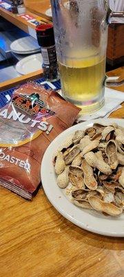 Getting started at The bar with a beer  and peanuts!