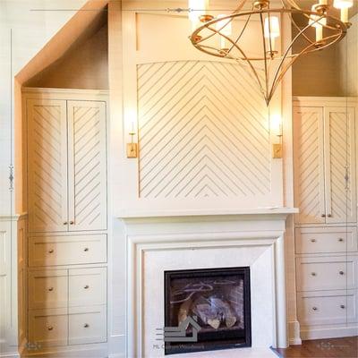 built-in library bookcase with chevron style panel and custom mantel