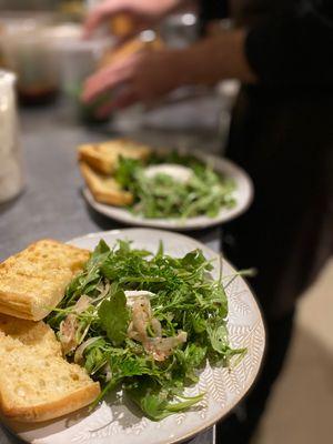 Homemade Boursin cheese arugula salad with caramelized onions