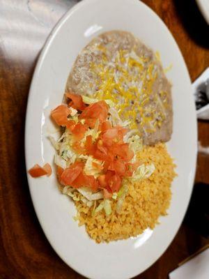 Refried beans and rice, served with the fajitas