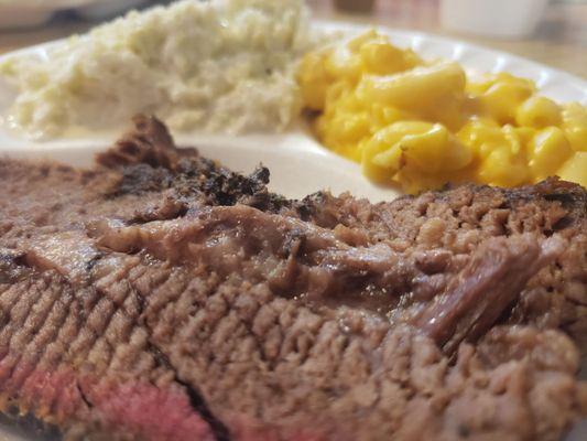 1/4 brisket with coleslaw and mac and cheese. Comes with buns. I loved it and my son (picky eater) loved it.