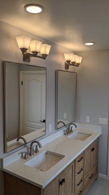 Two custom silver floating mirrors with fine beveled edge.