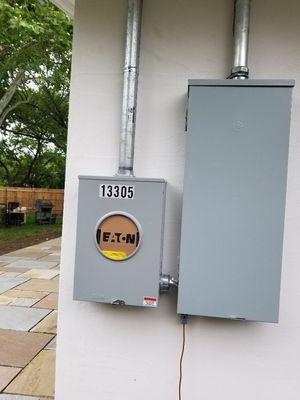 This is the new meter can and electrical panel. The service was being relocated on this house.