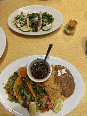 Birria taco meal in the front. Lengua, tripe, shrimp tacos in the back.