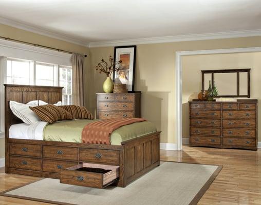 Solid wood bedroom sets with dovetailed full extension drawers under bed storage pedestal. Oak Park Mission Collection.