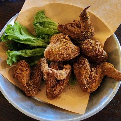 Wings, breaded and deep fried, then tossed in a dry rub. You can also choose a sauce.