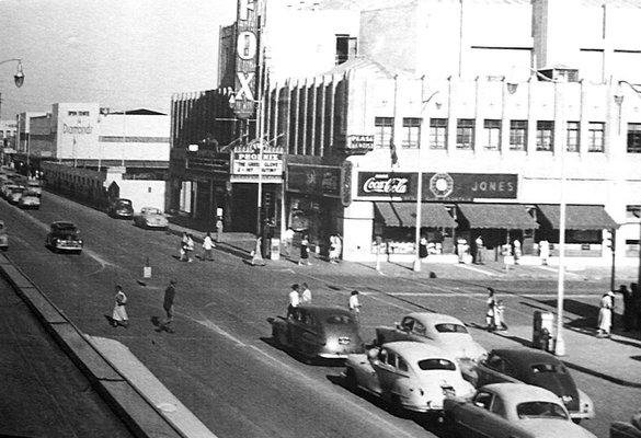 This photo was taken in the early 1950's in downtown Phoenix, by the Fox Theater. If you look closely you can see the "Pease Dentist" sign