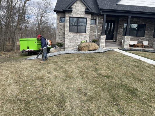 Making new landscaping beds around , planting trees , bushes, ect adding slate clips in beds