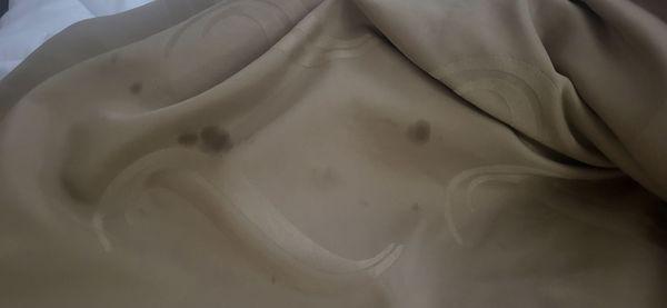 Oil stain on top bed cover