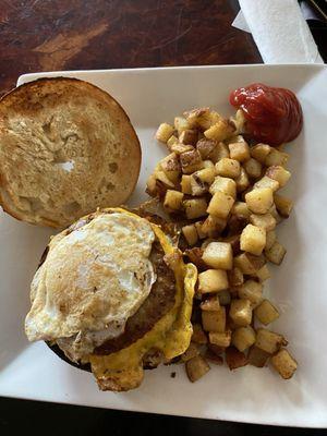 Sausage, Egg and Cheese on a bagel with home fries