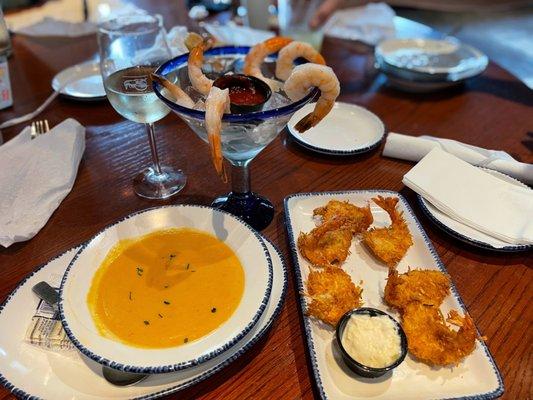 Lobster Bisque (Bowl), Parrot Isle Jumbo Coconut Shrimp and Signature Jumbo Shrimp Cocktail with a glass of Riesling