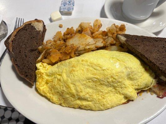 Corned beef hash and cheddar omelette.