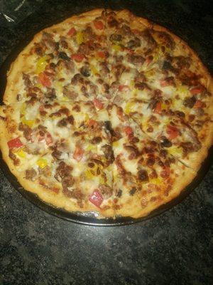 pizza with sausage, tomato, onion and peppers. I love the pizza's from here and they have a great deal on weds!