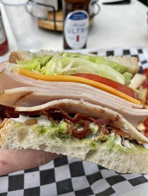 Look at those layers on this Salty Nun Turkey Club!