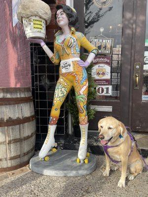 My dog, Rainey, posing with Barbara banana in front of the culinary room