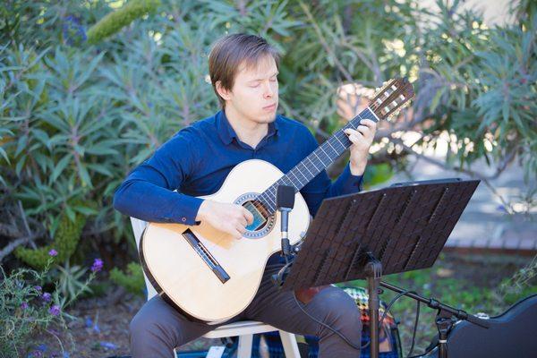 Christopher playing at our wedding