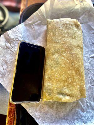 Cotijas burrito. It was huge. iPhone 11 next to it for comparison. (Keep in mind I added beans and rice) so good! Highly recommend!