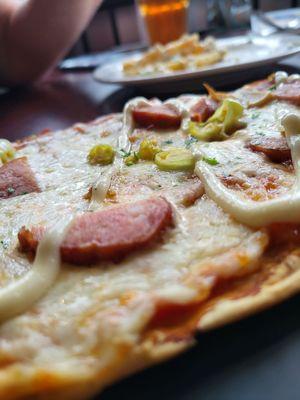 Polish flat bread: smoked kielbasa, mozzarella, pork belly, pepperoncini peppers and garlic aeoli over a nice, bright tomato sauce.