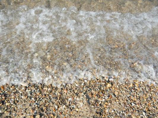 these pepples/rocks make it hard to walk on the beach and in the water.