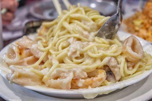 Baked Seafood with Cream Sauce on Pasta