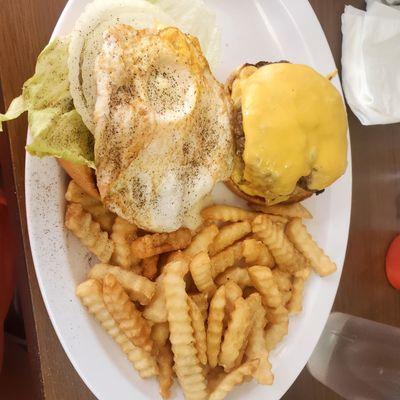 Double cheeseburger platter with a fried egg on top