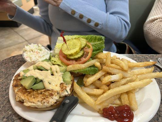 Chicken chipotle sandwich with dressing and avocado.