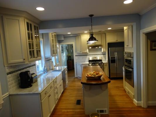 N.W. DC Kitchen. Farmer sink, vintage pendant lights, butcher block island top, marble counter tops