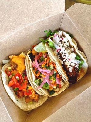 Fried chicken, fish and chipotle braised beef tacos.