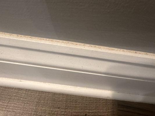 Baseboard not deep cleaned and employee said it was residue from wall paint that a professional painter did. Nonsense!