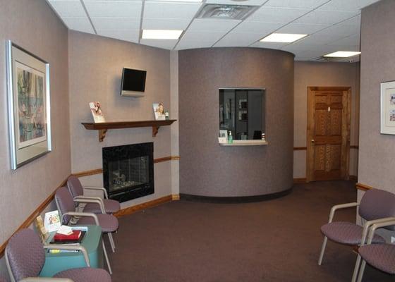 Our waiting room has a tv and fireplace