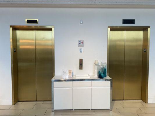 Gold ThyssenKrupp Impulse elevators, City Furniture Oakland Park