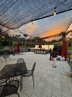 Outside, back patio and corn hole