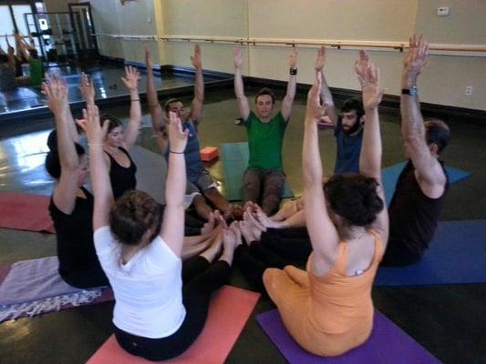 Building community at a partner yoga class at Peacebank yoga studio in Redwood City