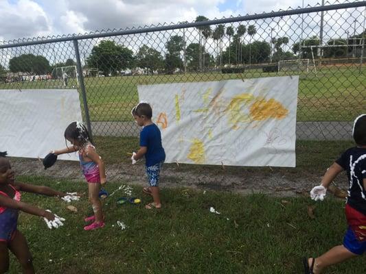 Our 3 year olds are out enjoying the fresh air and sunshine. They are getting creative and staying cool with water play...