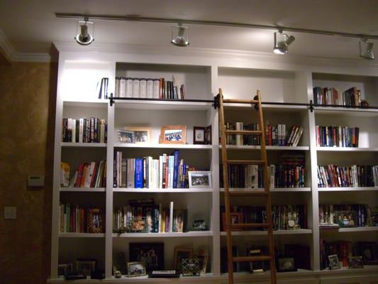 Track lighting over a bookcase