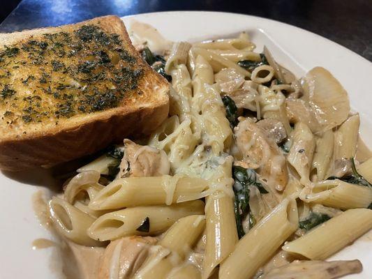 Penne with chicken and spinach in balsamic cream reduction.