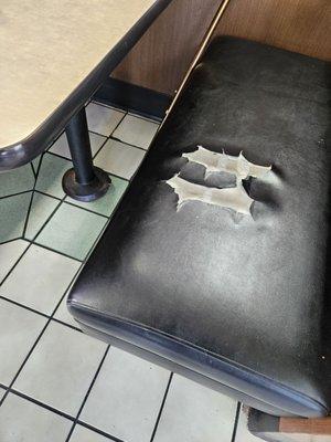 Torn Seat Cushion in Booth