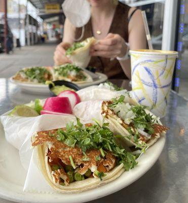 Tacos with cheese and vegetables and fresh OJ