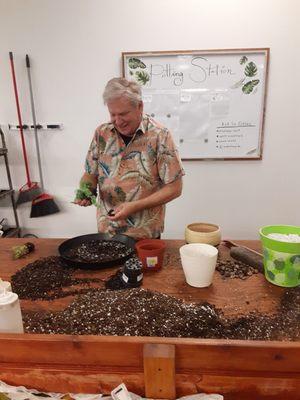 This is Steve showing us how to take our three plants and put them in a bigger planter