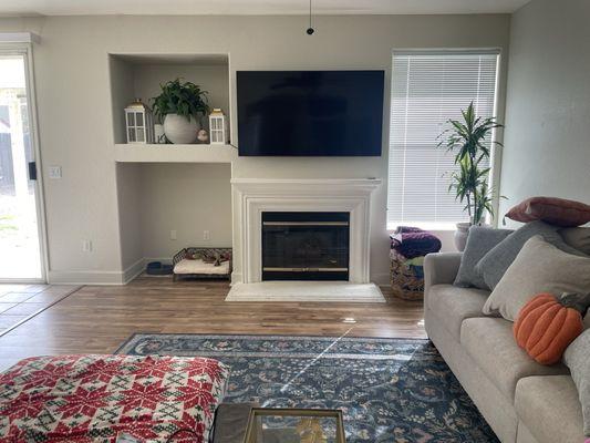 TV mount. The TV is perfectly centered to the wall (the fireplace is not centered). Hung it exactly where I wanted it.