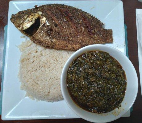 Tilapia (perfectly cooked) with potato leaf and brown rice.