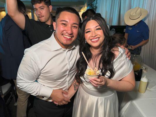 The newlyweds, Lyna and Michael, enjoy Tejano Raspas!