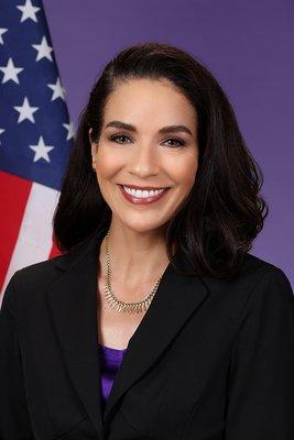 female head shot with flag