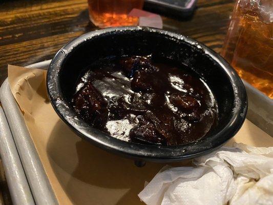 Dry as hell burnt ends smothered in terrible sauce.