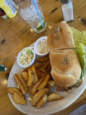 Fish sandwich with scrumptious jojos and Cole slaw with house made tartar sauce YUM