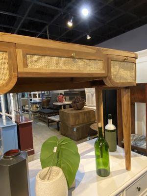 Writing desk with cane drawer fronts.