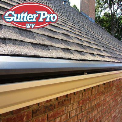 Our life time clog-free gutter guard system can be applied to shingle or metal roofs.