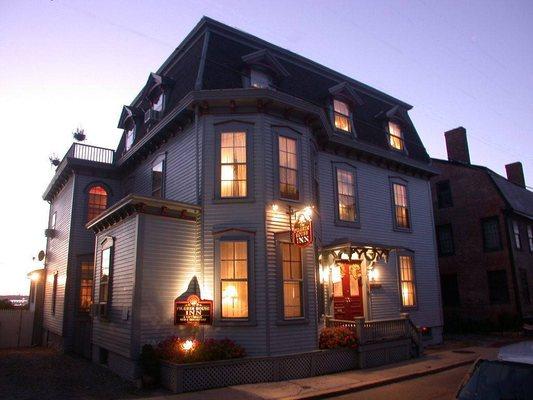 Ext. front of Pilgrim House at night.