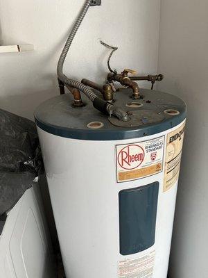 Removed old water heater with a new tankless , excellent work getting this old heater out.