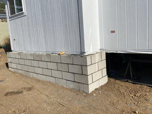 Underneath mobile home Block Wall